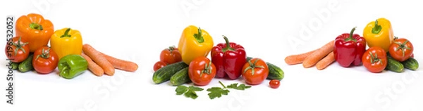 Fototapeta Red yellow and orange peppers with tomatoes on a white background. Cucumbers with colorful peppers in composition on a white background. Panoramic photo with vegetables on a white background..