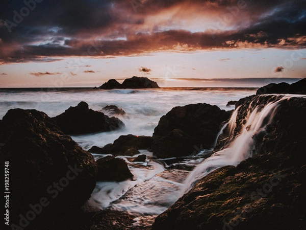 Fototapeta waterfall at sunset