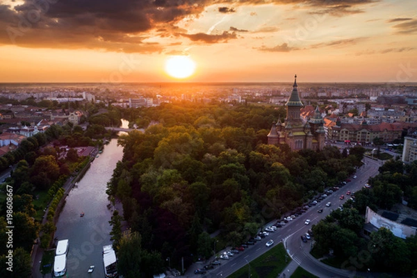 Obraz Beautiful red sunset in aerial view from Timisoara taken by a professional drone - Timișoara Orthodox Cathedral, Bega and Central Park