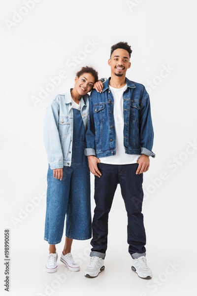 Fototapeta Full length image of Smiling african couple in denim shirts