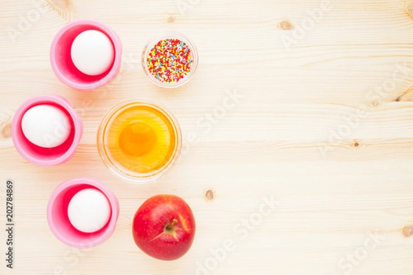 Obraz Ingredients for baking on the wooden background. Сookery, food, confectionery and home kitchen concept. Top view. Close up.