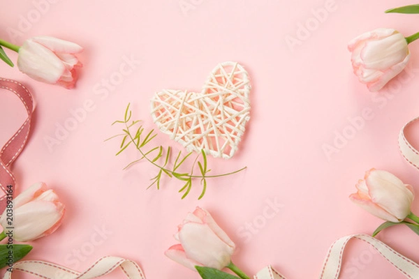 Fototapeta Festive flower pink tulips composition on the light pink background. Overhead top view, flat lay. Copy space. Birthday, Mother's, Valentines, Women's, Wedding Day concept.