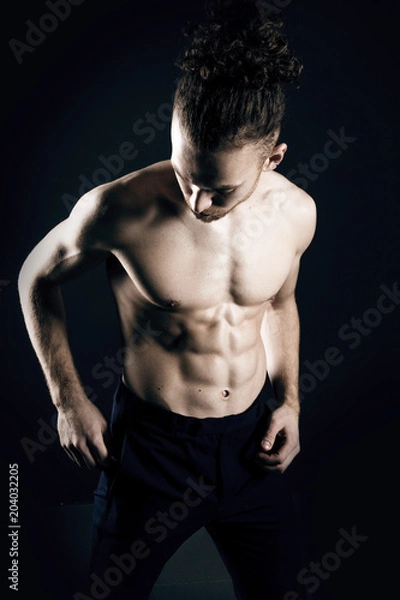 Fototapeta Young ginger topless man studio portrait