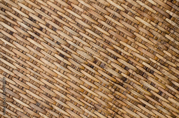 Fototapeta Background Old Thai handcraft of plaited bamboo strips weave pattern for texture.