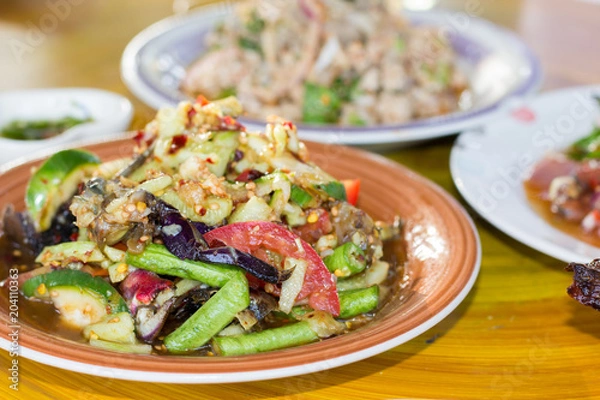 Fototapeta Spicy Cucumber Salad on table. Thailand food, Som Tum Taeng or cucumber salad Thai style.