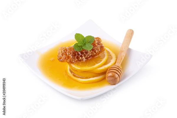 Fototapeta Lemon juice with honey isolated on a white background.