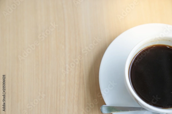 Fototapeta top view half of white coffee cup on wooden table