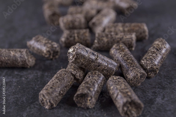 Obraz Pellets - new environmentally friendly fuel, close-up on a black background