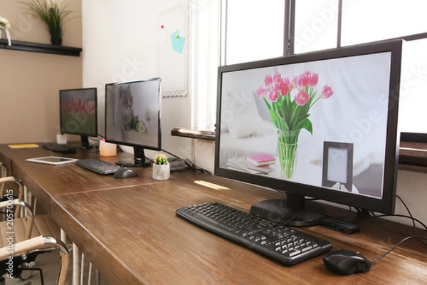 Obraz Stylish workplace interior with computers on tables