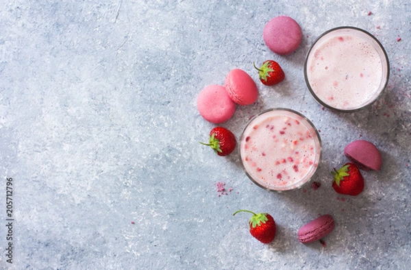 Fototapeta Milk and strawberries cool drink, fresh strawberries and macaroons