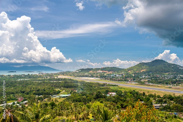 Fototapeta Aircraft runway and cityscape in Samui island