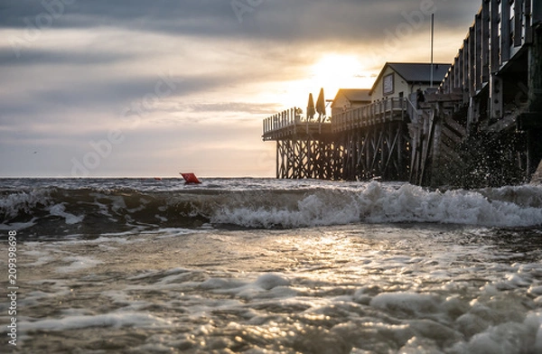 Fototapeta Wellen der Nordsee in der Abendsonne