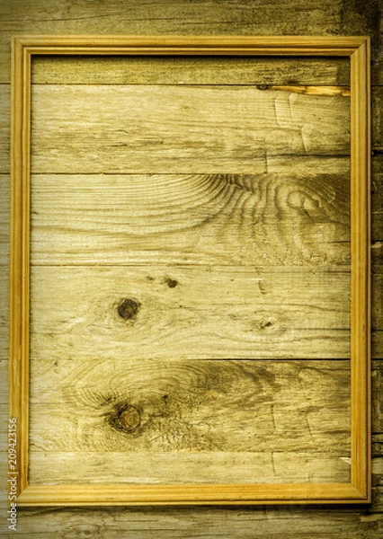 Fototapeta Frame on a wooden rustic texture for background. Rough weathered wooden board. Toned