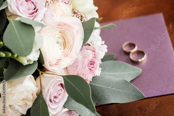 Fototapeta Wedding bouquet of roses and peonies. Bridal bouquet on wedding day. Bouquet of different flowers. Bouquet of beautiful pink, creme and white flowers