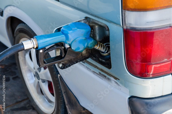 Fototapeta gas station being filled with fuel