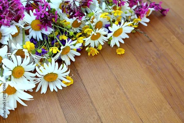 Fototapeta Wildflowers lie on the table