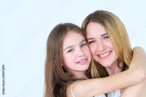 Fototapeta loving parent and child relationship. togetherness closeness and family unity concept. mother and daughter hugging