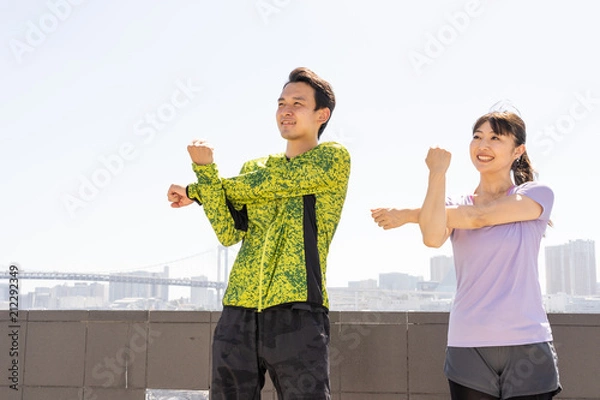 Fototapeta young asian couple stretching