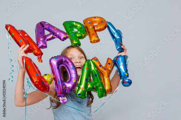 Fototapeta cheerful girl with balloons birthday letters