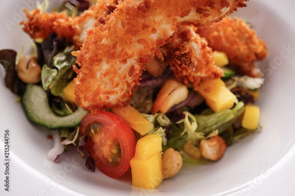 Fototapeta Deep Fried Chicken Goujons Served with a Medley Of Mediterranean Vegetables. 