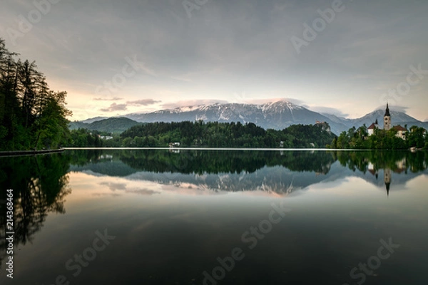 Fototapeta Amazing sunset time at famous Bled lake with church on the small island and a background of bled castle