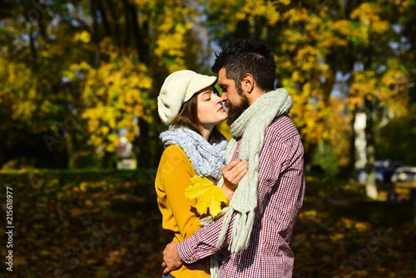 Fototapeta Young couple having fun in the autumn park