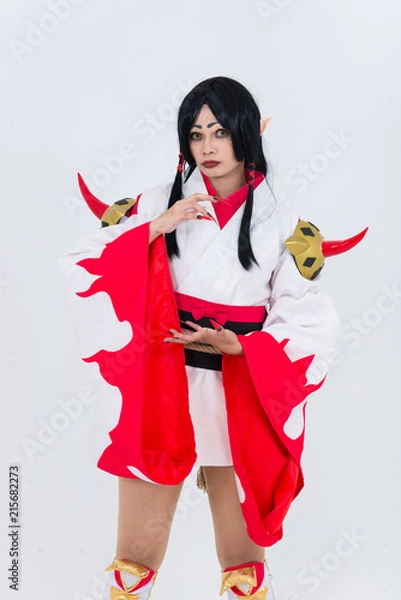 Fototapeta Portrait of beautiful asian girl wear cosplay game animation on white background,Thailand people,Red cloths devil style