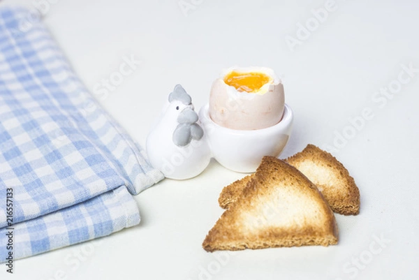 Obraz Soft boiled egg and toast for breakfast.