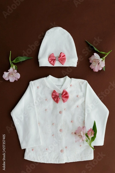 Fototapeta Children's jacket and hat for girl. Concept of children's clothing, fashionable children's clothes, fashion.