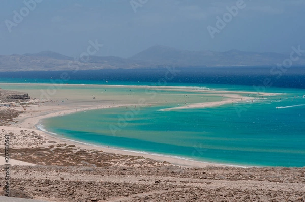 Fototapeta ocean landscape. blue ocean, sand beach with lagoon and watersport (kitesurfing and windsurfing)