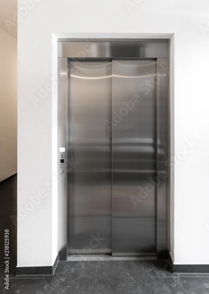 Fototapeta Modern elevator in apartment building, New elevator in operation, European modern stainless steel elevator in block of flats