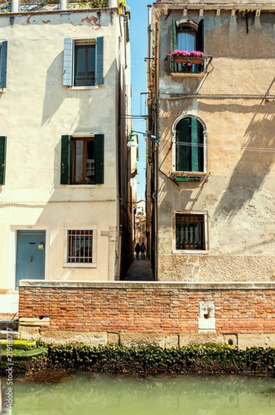 Fototapeta Little alley in the medieval center of Venice