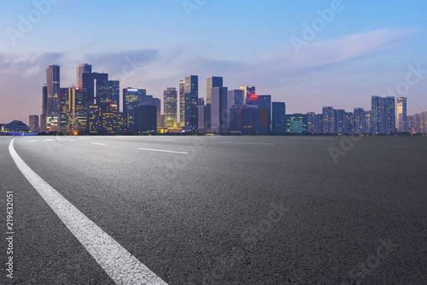 Fototapeta Urban road asphalt pavement and skyline of Hangzhou architectural landscape