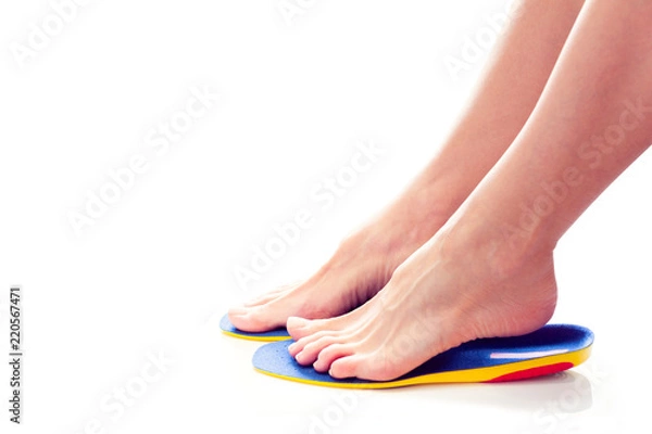 Fototapeta orthopedic insoles and female feet