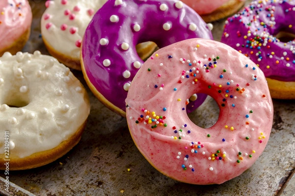 Fototapeta Fresh Baked Vanilla Bean Iced Doughnuts