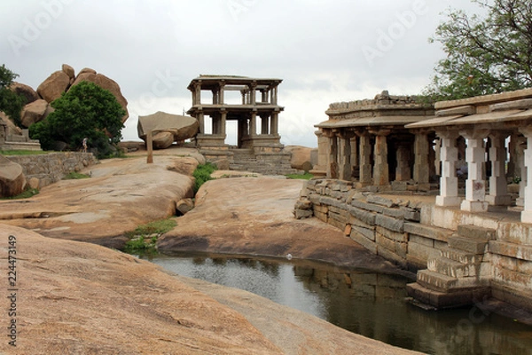 Fototapeta The formation of pillars, ruins, rocks, and Group Monuments of Temples in Hampi