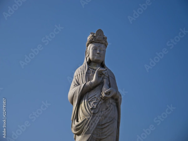 Fototapeta Buddha statue in Naksansa temple, South Korea