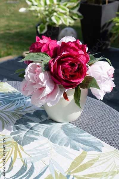 Fototapeta Colorful bouquet on a garden table