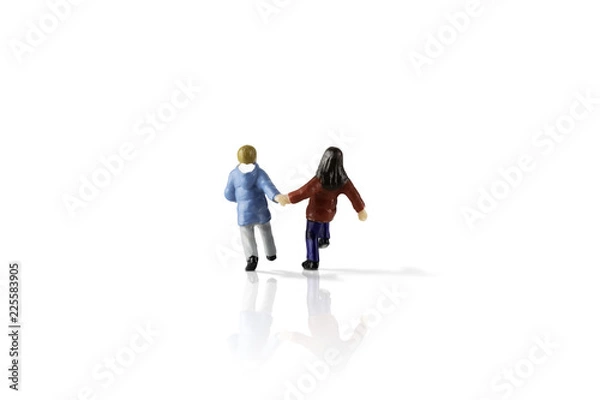 Fototapeta Isolated on white background image of miniature kids running. Clipping Path of the model included