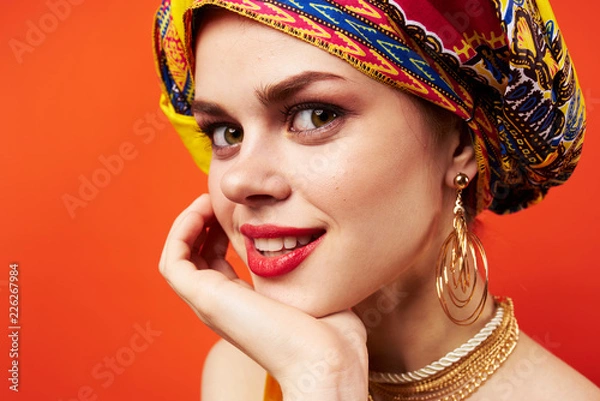 Fototapeta a woman with a turban on her head a confident look beautiful smile