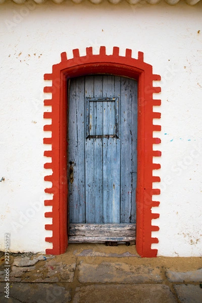 Fototapeta blue wooden door and red frame