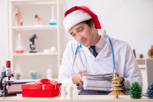 Fototapeta Doctor with gift box in the hospital