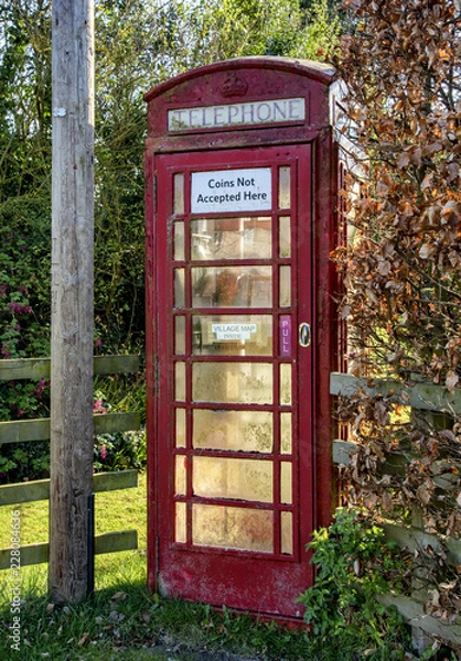 Obraz A red telephone box in Settrington village in East Yorkshire