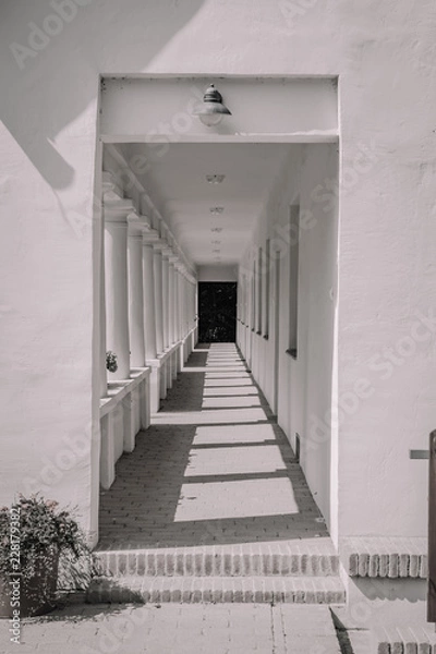 Fototapeta black & white corridor with doors