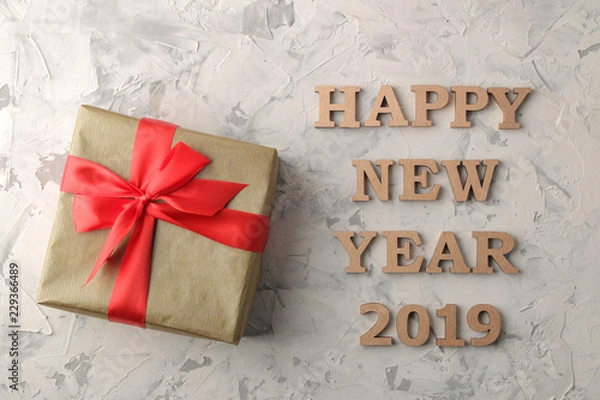 Fototapeta New Year 2019. Christmas. Holidays. Composition with New Year and Christmas gifts and the inscription happy new year