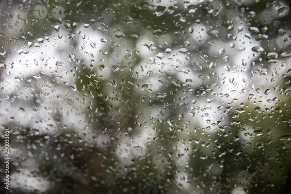 Fototapeta Water dripping on a glass. Use as background image for presentation.Rain during rainy season.Weather was