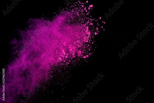 Fototapeta Pink powder explosion on black background. Colored cloud. Colorful dust explode. Paint Holi.