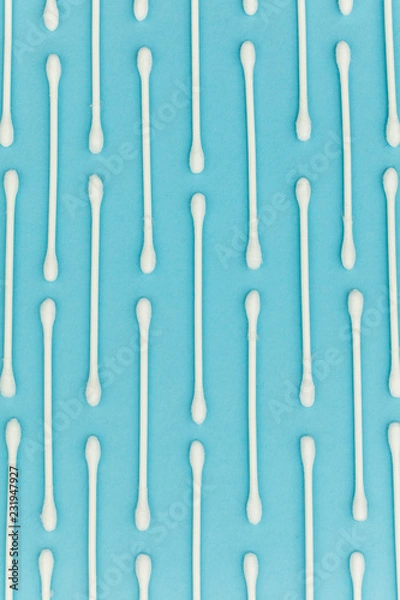 Obraz Cotton buds on a blue background. Sanitary qtip hygenic accessory. Plastic waste