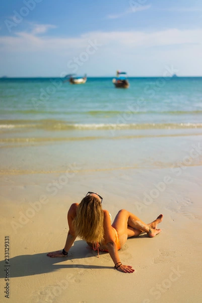 Fototapeta Woman relaxing on the beach in Thailand