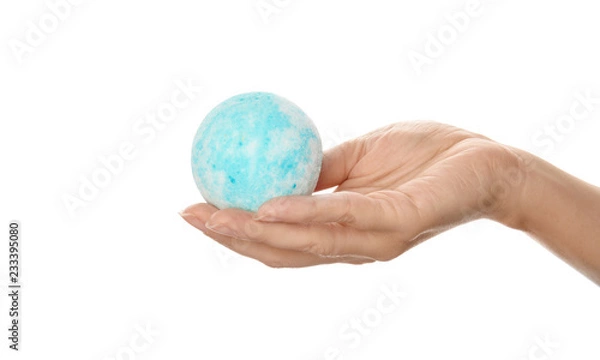 Fototapeta Woman holding bath bomb on white background, closeup